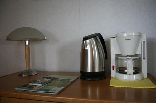 a coffee maker sitting on top of a table at B&B Korendijk in Zuid-Beijerland