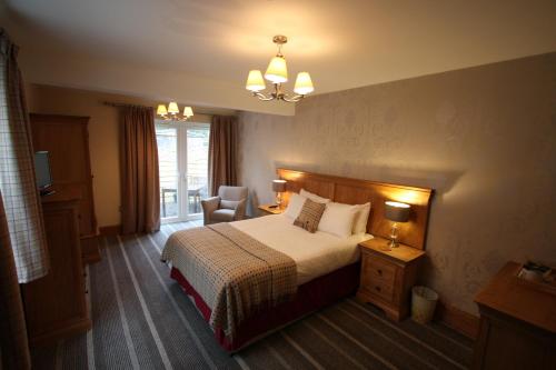 Un pat sau paturi într-o cameră la The Coledale Inn
