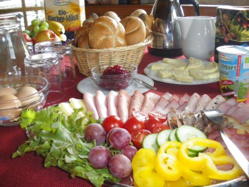 a table topped with lots of different types of food at BIO-Bauernhof Kurzeck in Göstling an der Ybbs