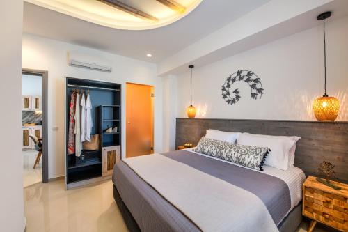 a bedroom with a large bed in a room at Abasa Suites in Fira