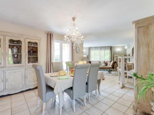 a dining room with a table and chairs at Holiday Home Villa Souleyas by Interhome in Sainte-Maxime