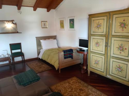 Ein Bett oder Betten in einem Zimmer der Unterkunft Ca' d'La Tonilla