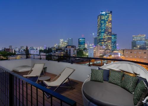 a balcony with a view of a city skyline at Penthouse 3BR near Rothschild bd by HolyGuest in Tel Aviv