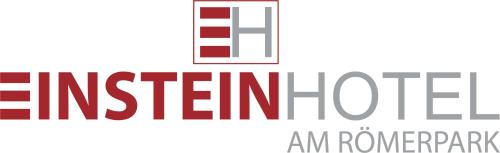 a sign with the text american institute an nonprofit at EINSTEIN Hotel am Römerpark in Andernach