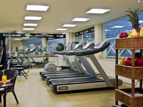 a gym with rows of treadmills and apples at Sofitel Buenos Aires Recoleta in Buenos Aires