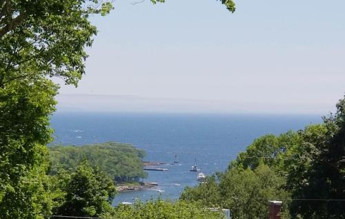 a view of a river with boats in the water at Timbercliffe Cottage Inn in Camden