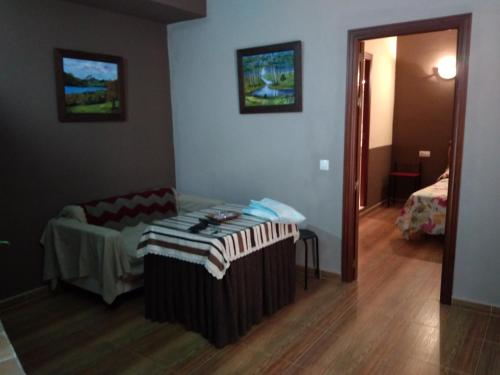 a room with a table and a chair in a room at Apartamento Casa Romero in El Bosque