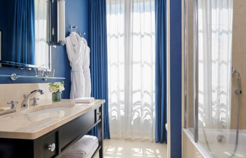 a bathroom with a sink and a shower at InterContinental Paris Le Grand by IHG in Paris