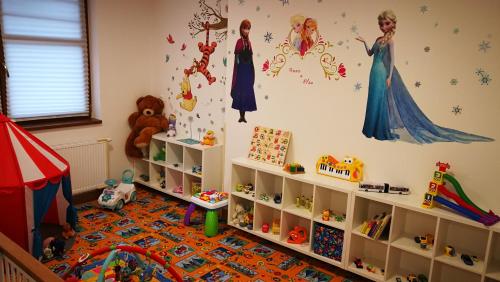 a childs room with disney characters on the wall at Parkhotel Smržovka in Smržovka