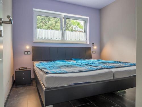 Cama ou camas em um quarto em Ferienhaus Ausblick Am Eichenberg