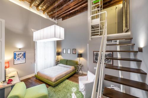 a bedroom with a staircase and a bed in a room at Il Regio Boutique Hotel in Cagliari