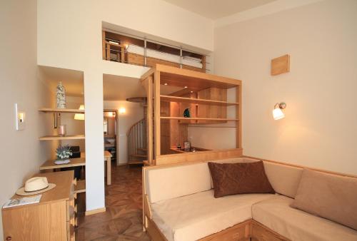a living room with a couch and a table at Apartments Erica Luxury in Novigrad Istria