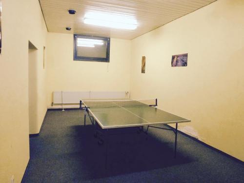 a room with a ping pong table in it at Ferienwohnung 424 mit Hallenbad in Bad Reichenhall