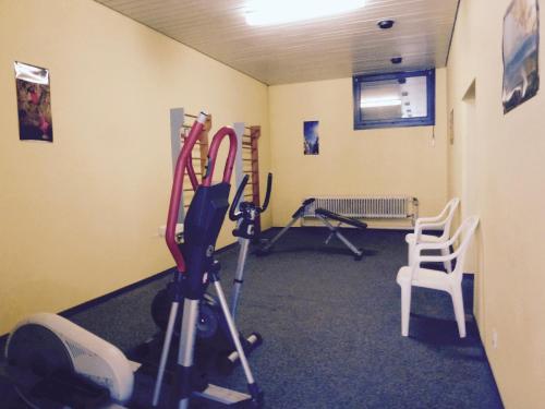 a gym with some exercise equipment in a room at Ferienwohnung 424 mit Hallenbad in Bad Reichenhall