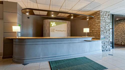 a lobby with a reception counter in a building at Holiday Inn At the Campus, an IHG Hotel in Manhattan