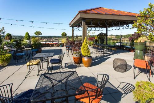a patio with tables and chairs and a gazebo at Holiday Inn Express Hotel & Suites North Sequim by IHG in Sequim