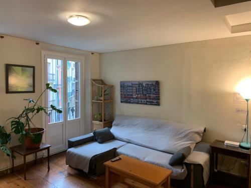 a living room with a couch and a table at Travelers Rest in Pamplona