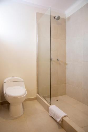 a bathroom with a toilet and a shower at Lima 18 Boutique in Lima