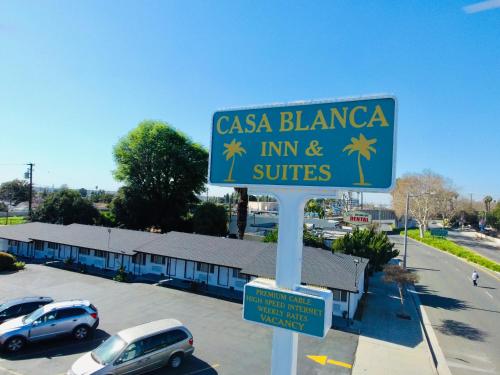 a blue street sign in front of a parking lot at Casa Blanca Inn - Whittier, Los Angeles in Whittier