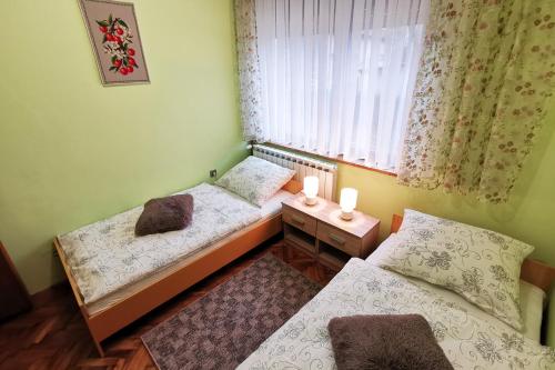 Кровать или кровати в номере Apartman Škudar