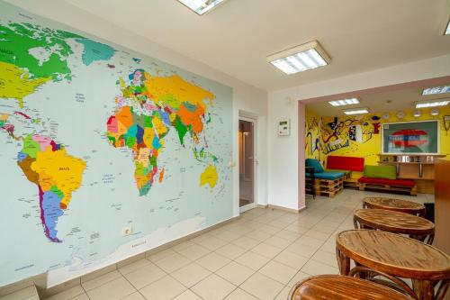 a large world map on the wall of a waiting room at Smart Hostel Sofia in Sofia