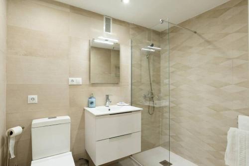 a bathroom with a shower and a toilet and a sink at Sol Apartment - C&G Benal Beach in Benalmádena
