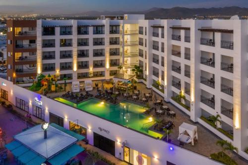 an overhead view of a building with a swimming pool at Medano Hotel and Spa in Cabo San Lucas