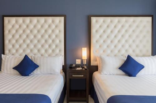 Cama o camas de una habitación en Medano Hotel and Spa