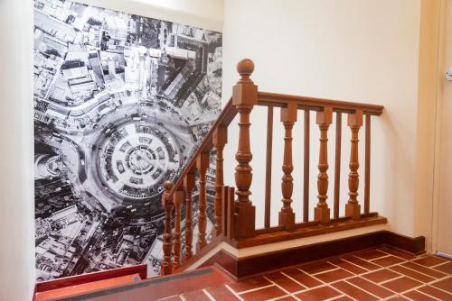 a staircase with a mural on the wall at Lima 18 Boutique in Lima