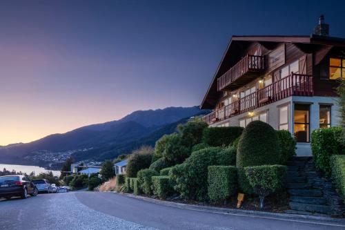 a house on the side of a road at Matterhorn Lodge by Sotheby's Luxury Rental Homes in Queenstown