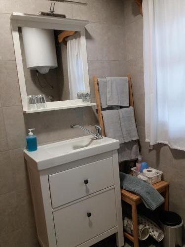 a bathroom with a white sink and a mirror at Kuća za odmor Cesarica in Marija Bistrica