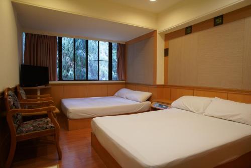 Cama o camas de una habitación en Wun Sun Hotel