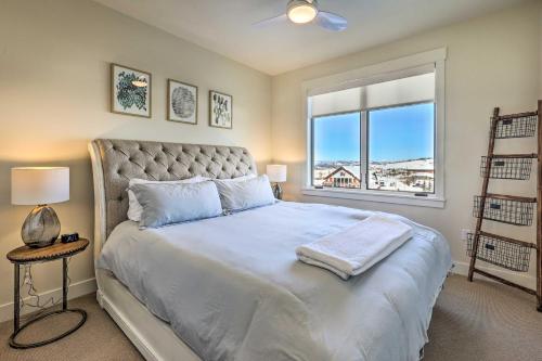 a bedroom with a large bed with a window at Condo with View - 1 Block to Main St - 4 Mi to Ski! in Winter Park