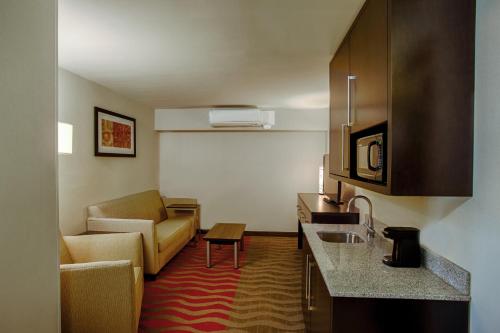 a room with a kitchen and a living room at Holiday Inn Express Baltimore West - Catonsville by IHG in Catonsville