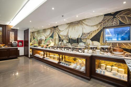 a display case in a store with a lot of food at The Q Hotel in Hanoi