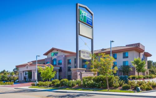 a building with a sign in front of it at Holiday Inn Express Hotel & Suites Atascadero by IHG in Atascadero