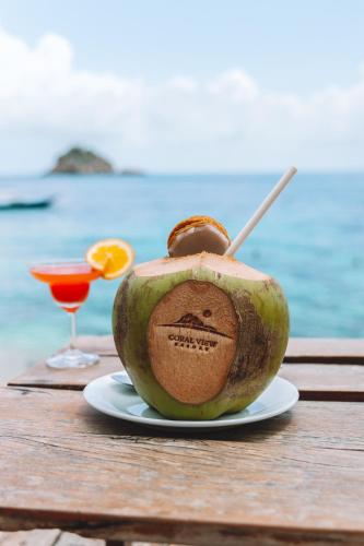 an apple with a face painted on it sitting on a table at Coral View Resort in Ko Tao