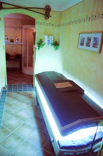 a room with a bed in the corner of a room at Appartementhaus Olympia Schlössl in Neustift im Stubaital
