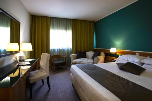 Кровать или кровати в номере BV Hotel Oly