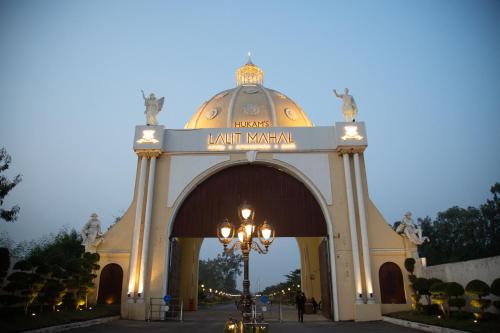 a large building with a street light in front of it at Hukam's Lalit Mahal - Hotel Convention Club in Raipur