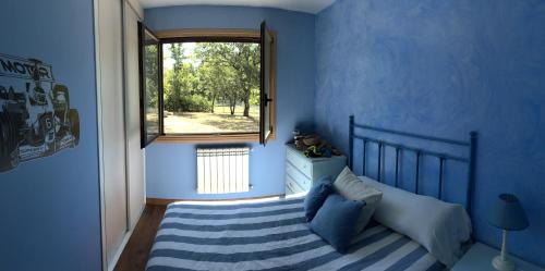 A bed or beds in a room at A PORTELA - Pereiro de Aguiar