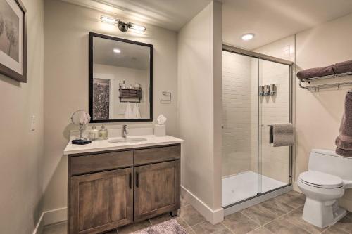 a bathroom with a toilet and a sink and a shower at Condo with View - 1 Block to Main St - 4 Mi to Ski! in Winter Park