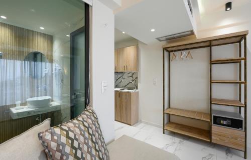 a bathroom with a sink and a mirror at Thetis Boutique Apartments in Neos Marmaras