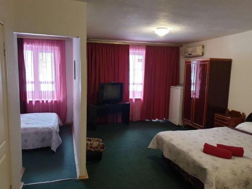 En eller flere senger på et rom på Mini Hotel Vesna