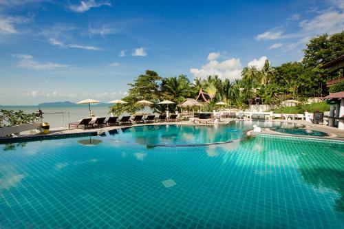 a pool at a resort with a view of the ocean at Banburee Resort & All Spa Inclusive in Laem Set Beach