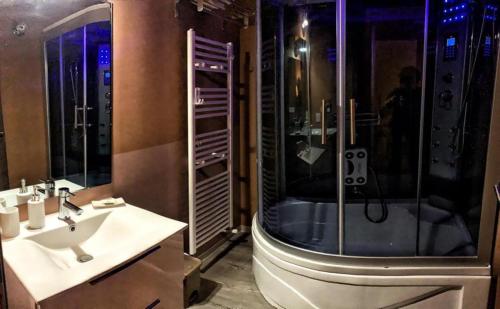 a bathroom with a shower and a sink and a tub at Dimora Nettare in Brindisi