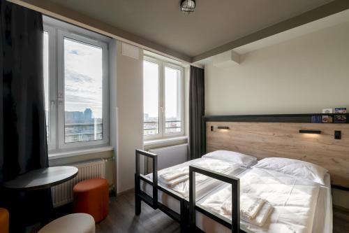 Кровать или кровати в номере a&o Copenhagen Sydhavn