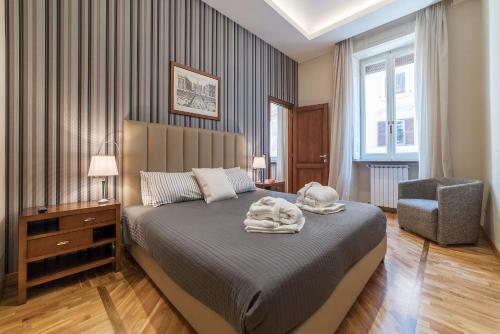 A bed or beds in a room at 900 Apartments Lazio, Emilia & La Corte
