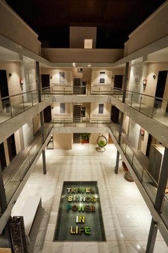 a large building with a movie poster on the floor at Aureole Mrida - A Boutique Hotel in Lonavala