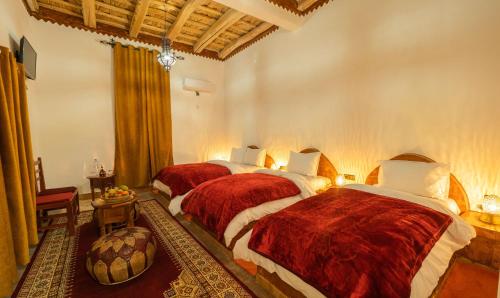 Ein Bett oder Betten in einem Zimmer der Unterkunft Hotel Riad Bahammou